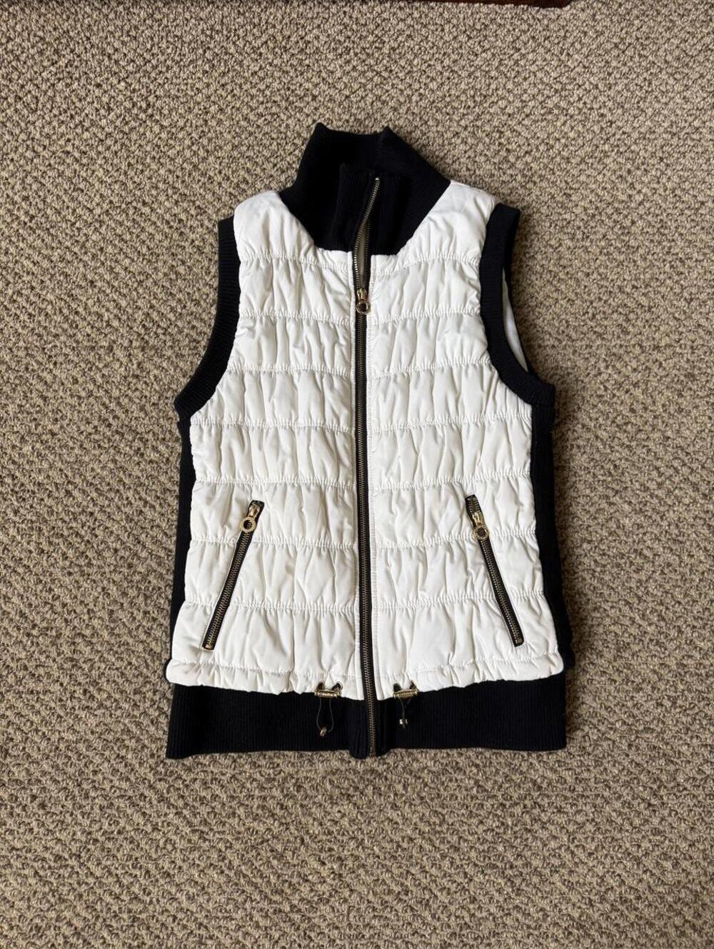 white and black Calvin Klein jacket vest with gold zipper